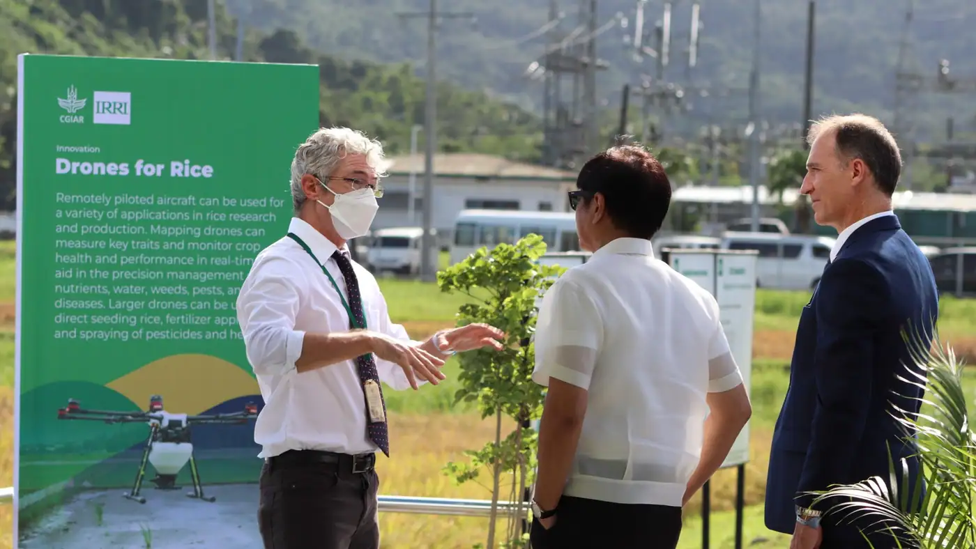 Drone pilot launching an agricultural spraying drone